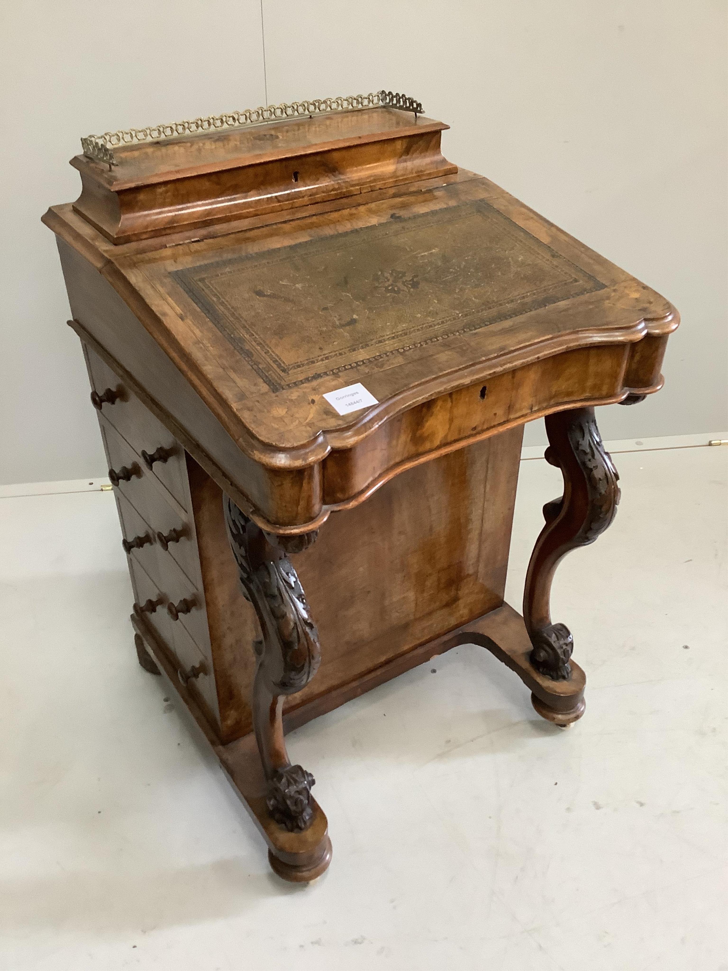 A Victorian walnut and marquetry inlaid Davenport, width 53cm, depth 53cm, height 82cm. Condition - fair